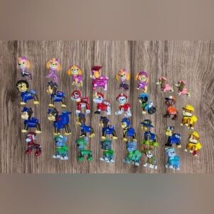31 pieces Paw Patrol miniature figures, which are  from various theme sets